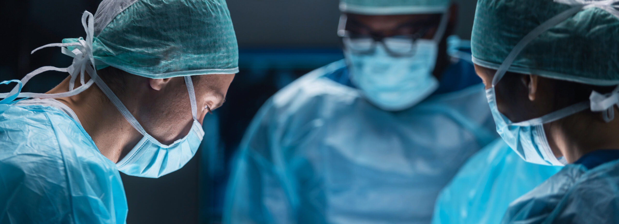Surgical team performing a procedure in a modern operating room