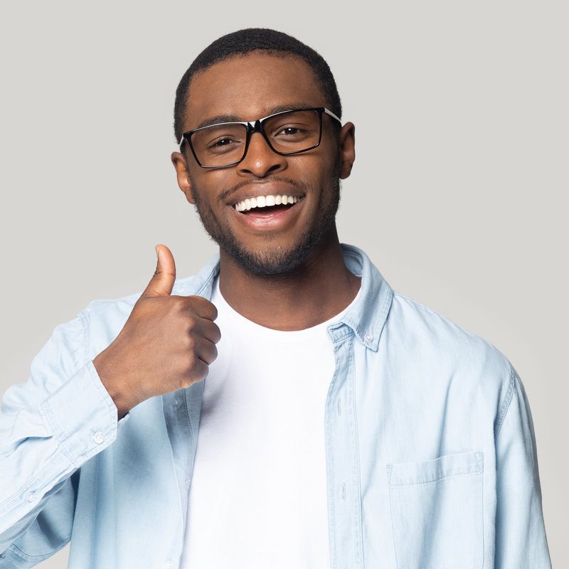 Head shot happy excited african american man showing thumbs up